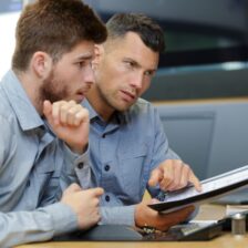 two male engineers working with new project