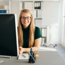 woman smiling at computer